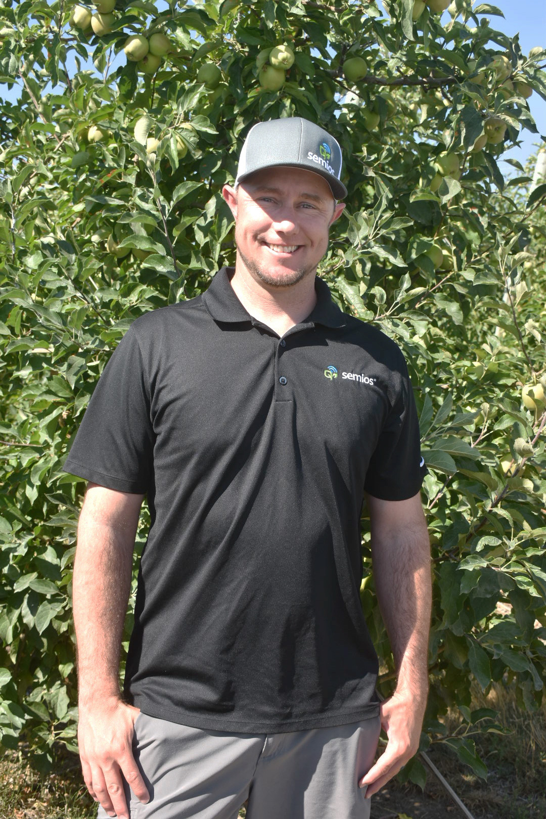 Justin Pearson in an apple orchard