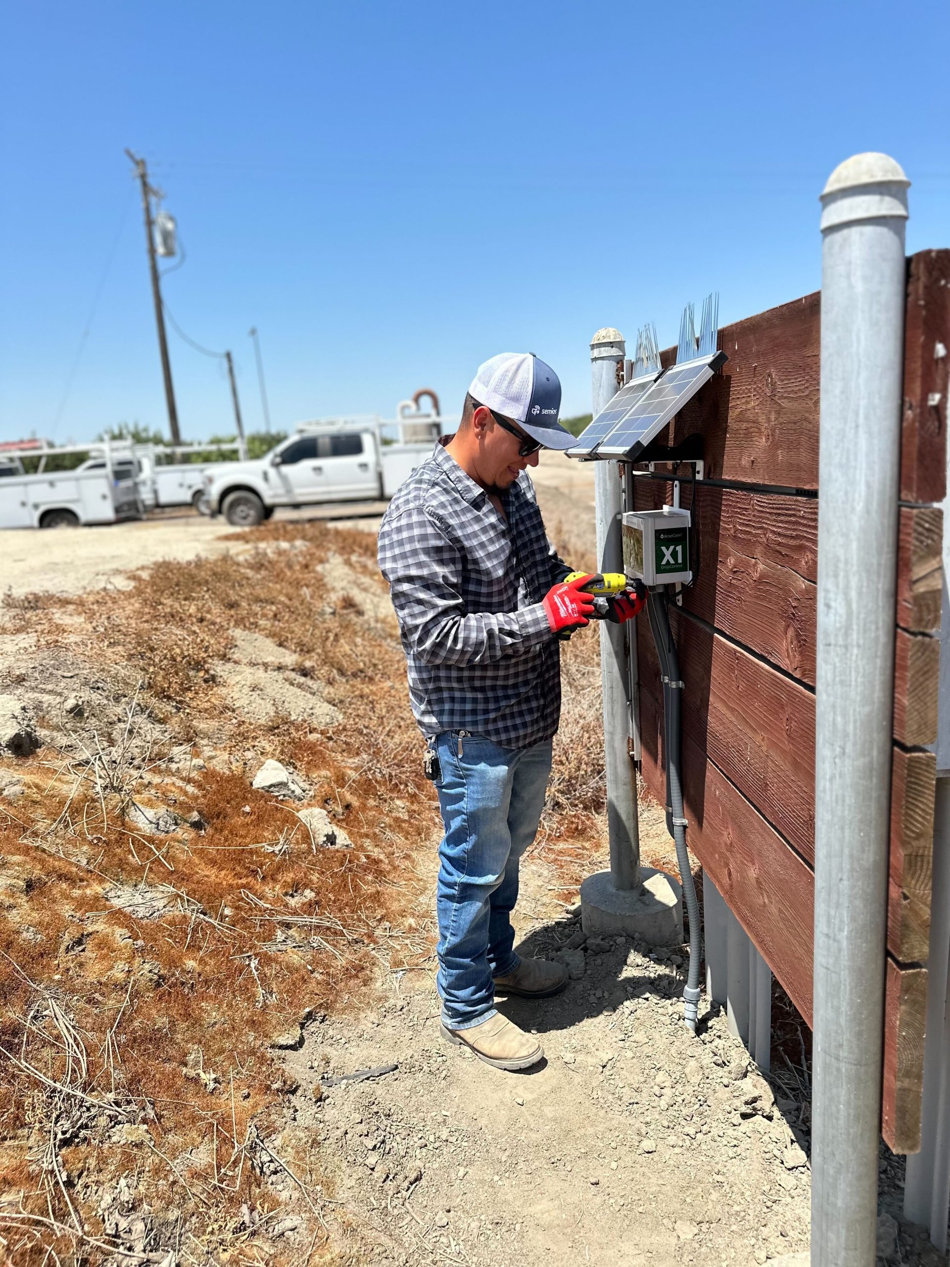 Semios field technician installing a WiseConn box