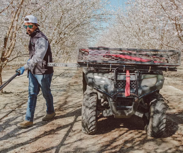Semios Field Services team member in an almond orchard