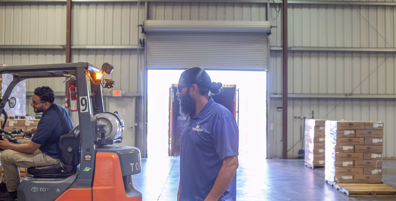 Aman Sandhu overseeing workers in the warehouse